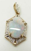 A 9ct gold pendant set with an oval black opal cabochon and diamonds, 2.4g