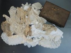 A collection of 18/19thC lace including ribbon, trim, remnants, panels etc, in metal deed box