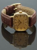 Omega ladies wristwatch ref. 511.413 with black hands and baton markers, gold dial, gold plated case