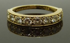 An 18ct gold half eternity ring set with nine diamonds each approximately 0.1ct, size K, 2.90g