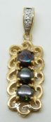 A 9ct gold pendant set with three round cut boulder opals and diamonds, 2.9g