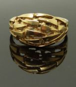 A 9ct gold ring in a pierced bespoke design, size P, 3.81g