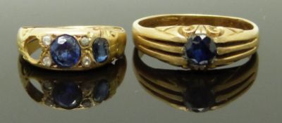 Two yellow metal rings set with synthetic sapphires, sizes F & N, 6.52g