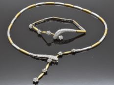 A 14ct gold bi-coloured bracelet and necklace set with cubic zirconia, 30.8g