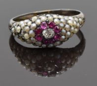 Georgian / Victorian ring set with an old cut diamond surrounded by rubies and seed pearls, size M
