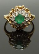A 9ct gold ring set with a round cut emerald surrounded by diamonds, size L, 4.00g