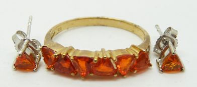 A 9ct gold ring set with six trilliant cut Salamanca fire opals and a pair of 9ct white gold