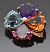 A four leaf clover brooch set with trilliant cut Brazilian aquamarine, amethyst, citrine and garnet