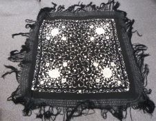 A 19th/20thC Chinese black shawl with embroidered chrysanthemum decoration and long fringe, 210 x