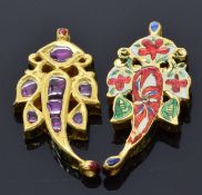 A pair of Indian yellow metal pendants set with enamel to one side and foiled rubies set to the