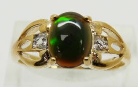 A 9ct gold ring set with an oval Mezezo opal cabochon and diamonds, 3.2g, size T