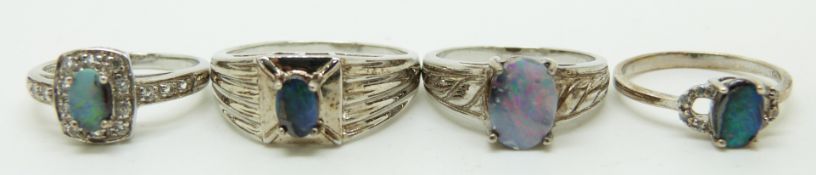 Four silver rings set with boulder opal, size L, M, N, T