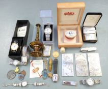 A collection of items including white metal Chinese plaques or ingots, weight 406g, watches, 1851