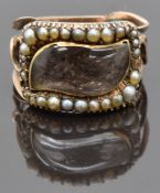 Georgian mourning ring set with plaited hair in a teardrop shaped glass setting surrounded by seed