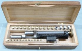 Cased watch/clock maker's lathe collets and pin vice