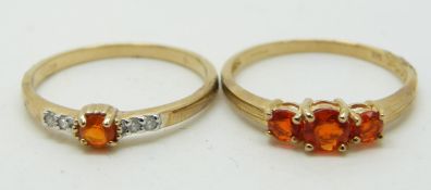 Two 9ct gold rings, one set with a Mexican fire opal and diamonds and the other three fire opals,