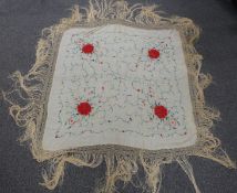 A 19th/20thC Chinese ivory silk shawl with embroidered chrysanthemum decoration and long fringe, 200