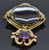 Victorian yellow metal brooch set with an amethyst and a Victorian agate brooch