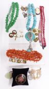 A collection of jewellery including coral, jade style quartz and turquoise style necklaces, silver