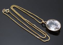 Edwardian 9ct gold pendant set with an oval quartz on a 9ct gold chain, 7.5g