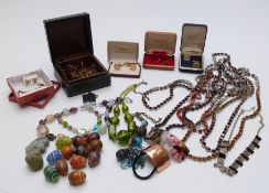A collection of costume jewellery including enamel cufflinks, necklaces, brooches, etc