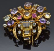 A yellow metal pin / brooch set with square cut sapphires, citrine, amethyst, aquamarines and