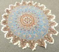 Turkish rosette shaped rug with light blue ground and floral field design, diameter 148cm