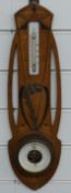 Art Nouveau aneroid barometer with inlaid marquetry decoration with floral brass overlay, 49cm tall