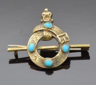 Victorian love knot / mourning brooch set with turquoise cabochons and engraved scrolling