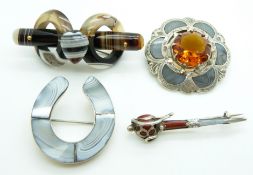 A white metal brooch in the form of a horseshoe set with agate, a Scottish white metal kilt pin/