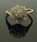 A 9ct gold ring set with a cluster of diamonds, size M, 2.41g