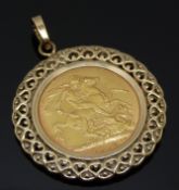 George V 1918 gold full sovereign with Bombay Mint mark, in 9ct gold surround, 11.2g