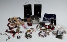 A collection of jewellery including necklaces, bracelets, brooches, etc
