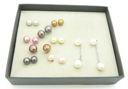 Nine pairs of silver earrings set with various coloured pearls
