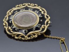 Victorian mourning brooch set with black enamel reading 