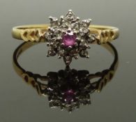 A 9ct gold ring set with a ruby and diamonds, 1.6g, size O/P