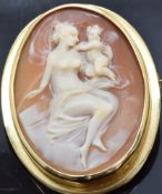 An 18ct gold brooch/pendant set with a cameo depicting a woman and child, 3.8 x 3cm
