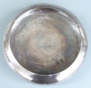 Japanese white metal bowl raised on three ball feet, marked to underside Suzuyo 950, diameter
