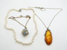 A strand of cultured pearls, a pressed amber pendant, and a 9ct gold pendant filled with opal