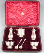 Cased Edward VII hallmarked silver cruet set comprising two peppers, two salts, mustard with green