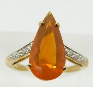 A 9ct gold ring set with a pear cut fire opal and diamonds, 3g, size N