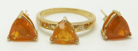 A 9ct gold ring set with a trilliant cut fire opal and diamonds and a pair of 9ct gold earrings