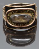Georgian mourning ring set with plaited hair in a glass compartment surrounded by black enamel