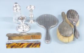 Hallmarked silver dressing table items comprising hand mirror, two combs and two brushes, silver