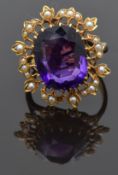Edwardian 9ct gold ring set with a cushion cut amethyst surrounded by seed pearls, size P/Q, 8.23g