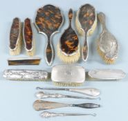 Hallmarked silver mounted dressing table items comprising tortoiseshell mounted set of hand mirror