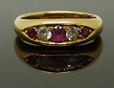 An 18ct gold ring set with rubies and diamonds, Birmingham 1915, size M/N, 6.00g