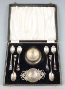 Art Deco style hallmarked silver tea set comprising six teaspoons, tea strainer and stand,