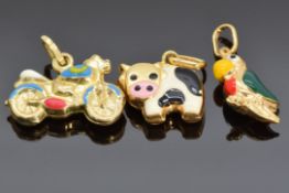 Three 9ct gold and enamel charms, one in the form of a cow, one a parrot and the other a