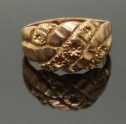 A 9ct rose gold keeper ring with floral decoration, size J, 4.17g